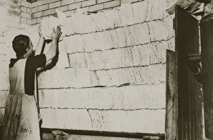 Baking Gallery: Stacking unleavened bread for the Passover in a Jewish bakery, 20th century. Artist
