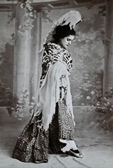 Consideration Prints: A standing woman, posed with an upraised fan and pointed toe