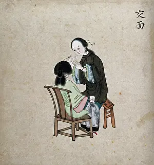 Removing Prints: A standing woman preparing to remove facial hair from seated woman using a piece of string