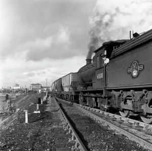 Steam loco no 65811 hauling coal from Lynemouth Colliery, Northumberland, 1963. Artist