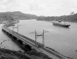 Panama Prints: Steamship passing Chagres River crossing, between 1904 and 1920. Creator: Unknown