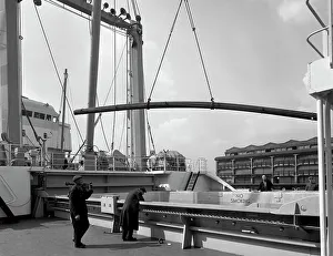 Steel bars being loaded onto the Manchester Renown, Manchester, 1964. Artist
