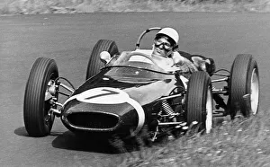 S Moss Prints: Stirling Moss taking a bend in a racing car, (c1960-c1961?)