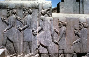 Stone relief showing subjects bringing tribute, South Iran, 6th-5th century BC Stone relief showing subjects bringing tribute, South Iran, 6th-5th century BC