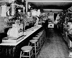 Bar Stool Prints: Store of Chas. W. Seymour, Plattsburg, N.Y, between 1895 and 1910. Creator: Unknown