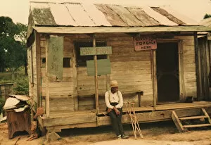 Old Man Collection: A store with live fish for sale, vicinity of Natchitoches, La. 1940. Creator: Marion Post Wolcott