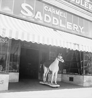 Model Gallery: Storefront of San Joaquin Valley town, Fresno, on U.S. 99, California, 1939. Creator: Dorothea Lange