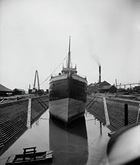 Graving Dock Prints: Str. John Craig in dry dock, Detroit, between 1900 and 1905. Creator: Unknown