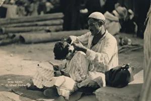 Cutting Hair Prints: A Street Barber, Cairo, Egypt, 1936
