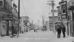 Nome Alaska United States Prints: Front Street covered with snow, between c1900 and c1930. Creator: Lomen Brothers