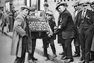 Sell Prints: Street hawker selling football favours in Kings Cross, London, 1911 (1926-1927)