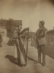 Expatriate Prints: Street musicians with a harp and violin in the upper yard of Dom Smith