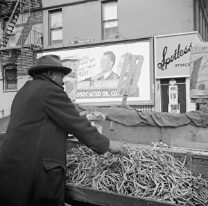 Trader Gallery: Street peddler in the Harlem section, New York, 1943. Creator: Gordon Parks