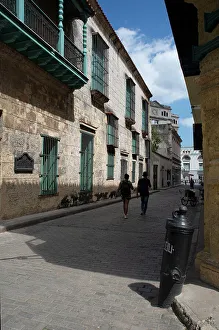 Bollard Prints: Street scene with couple in the distance, Havana, Cuba, 2024. Creator: Ethel Davies