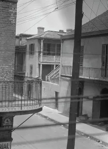 Balcony Rail Prints: Street scene, New Orleans, between 1920 and 1926. Creator: Arnold Genthe