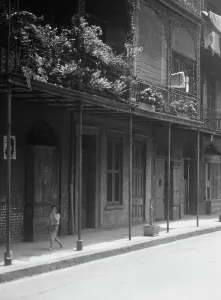 Balcony Rail Prints: Street scene, New Orleans, between 1920 and 1926. Creator: Arnold Genthe