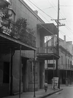 Creole Prints: Street scene, New Orleans, between 1920 and 1926. Creator: Arnold Genthe