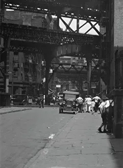Sidewalk Prints: Street scene in New York City, between 1896 and 1942. Creator: Arnold Genthe