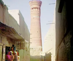 Bazaar Prints: Street scene with vendors, minaret in background