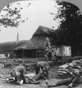 Stretcher Case Collection: Stretcher bearers caring for wounded at an improvised first aid post, World War I, c1914-c1918