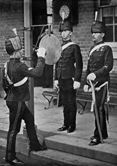 Images Dated 25th August 2009: Striking the gong at the main gate of the Aldershot cavalry barracks, Hampshire, 1896
