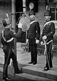 Aldershot Prints: Striking the gong at the main gate of the Aldershot cavalry barracks