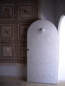 Tunisia Africa Prints: Studded door and mosaic, El Jem Museum, El Djem, Tunisia, 2009. Creator: Amanda Waite