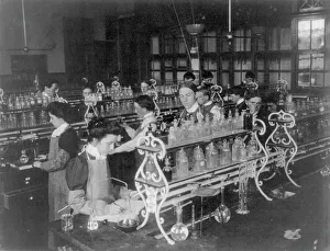 Students in a chemistry class conducting an experiment, Western High School, Washington DC, (1899?). Creator: Frances Benjamin Johnston