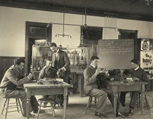 Practical Prints: Students constructing telephones at Hampton Institute