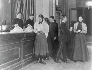Students getting beverages from a counter, Western High School, Washington, D.C. (1899?). Creator: Frances Benjamin Johnston