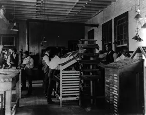 Segregated Prints: Students working in print shop