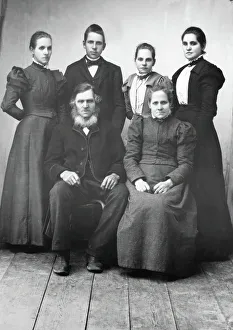 Studio portrait: Sitting: Lispa Per, Karin Eriksson Standing from left Anna, Edvard... 1890-1900. Creator: Lars Olsson Akerman. Studio portrait: Sitting: Lispa Per, Karin Eriksson Standing from left Anna, Edvard... 1890-1900