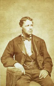 Watch Chain Prints: Studio portrait of unidentified seated young man