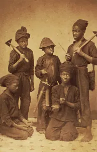 Chimney Sweep Prints: Studio portrait of young chimney sweeps, c1870. Creator: J. N. Wilson
