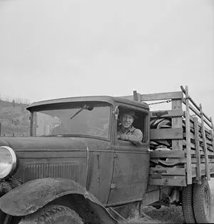 Stump farmer bringing load of slab wood to sell in town, Bonner County, Idaho, 1939. Creator: Dorothea Lange