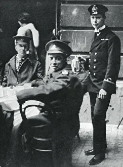 Sub-Lieutenant Prince Albert serving tea to wounded soldiers at Buckingham Palace, 1916. Artist: Unknown Sub-Lieutenant Prince Albert serving tea to wounded soldiers at Buckingham Palace, 1916. Artist: Unknown