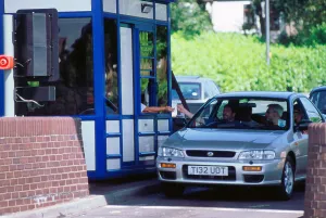 Subaru using toll booth on Itchen bridge, Southampton