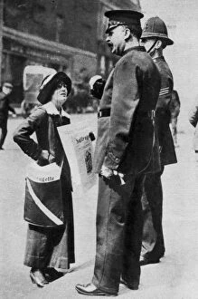 A suffragette confronting two policemen, 1913 (1937).Artist: Sport & General