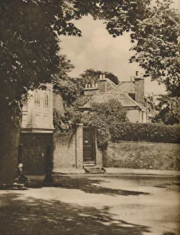 Highgate Prints: Sunlight and Shadow in a Winding Highgate Road, c1935. Creator: Paterson