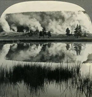 Geysers Prints: Sunrise in Yellowstone Park, over Upper Geyser Basin, Wyoming, c1930s. Creator: Unknown