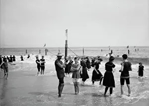 Holidaymakers Prints: Surf bathing, between 1900 and 1905. Creator: Unknown