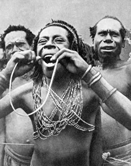 Images Dated 13th November 2007: Swallowing canes in a ceremonial ritual, New Guinea, 1936.Artist: Wide World Photos