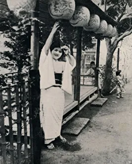 Adjusting Gallery: Sweet natured smile of tea-house maid, called nesan - elder sister, c1900, (1921)