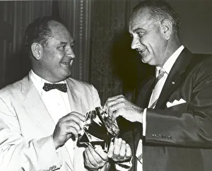 Satellite Prints: T. Keith Glennan shows Lyndon Johnson aluminized mylar flim used to make the Echo I