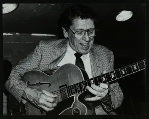 Tal Farlow playing the guitar at The Bell, Codicote, Hertfordshire, 18 May 1986. Artist