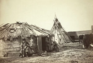 Wives Collection: Tatar couple with a small boy in front of their home, between 1885 and 1886. Creator: Unknown