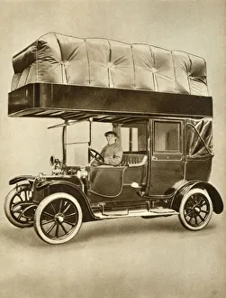 Cabbie Gallery: Taxi cab with gas-bag device on specially fitted roof, 1914-1918, (1935). Creator: Unknown