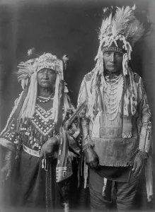 Plaits Prints: Tearing Lodge and wife(?), c1910. Creator: Edward Sheriff Curtis