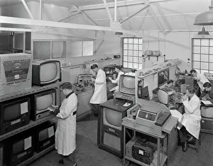 Laboratory Coat Prints: Technicians at work in Clays TV repair in shop, Mexborough, South Yorkshire, February 1959
