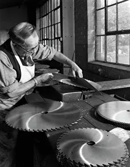 Steelworker Prints: Tensioning circular saws at Slack Sellers & Co Ltd, Sheffield, 1963. Artist